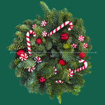Candy Cane Christmas Wreath Top-down view of a 10-inch Candy Cane Christmas wreath decorated with peppermint swirls, candy canes, and red baubles, displayed on a green background with a size guide. 3